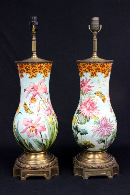 Pair 19th c. Theodore Deck Sevres vases: Decorated with flowers & butterflies. Artist signed. Mounted as lamps. Approx. 15.5" H x 9" W, 27.5" H overall. Please read our terms of sale.