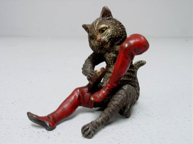 Austrian bronze "Cat Polishing Boots": Austrian bronze "Cat Polishing Boots." Approx. 3" H X 3.5". Please read our terms of sale.