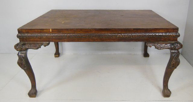 19th c. heavily carved mahogany dining room table: With side extentions, needs refinishing, as is condition. Approx. 30.5" H x 59" W x 43.5" D, fold out leaves 13.75" x 20".