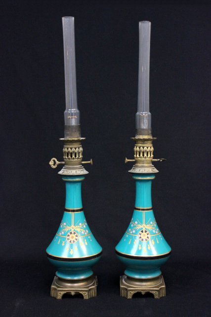 Pair 19th c. Victorian English porcelain oil lamps: Possibly Minton, handpainted. Approx. 17" H.