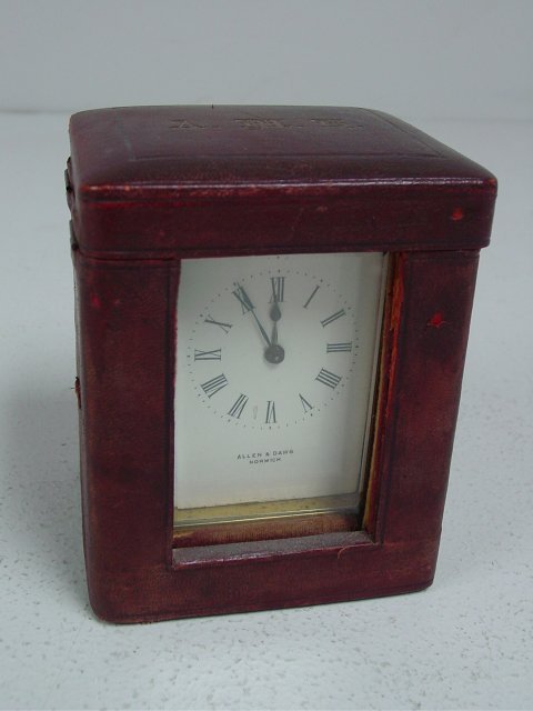 Carriage clock in monogrammed leather case: Allen & Daws, Norwich. Approx. 5" x 4" x 3.5".