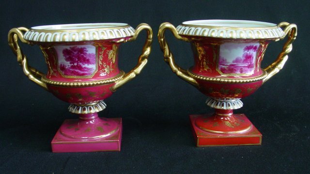 Pair Royal Worcester style porcelain scenic vases: Handled. Approx. 8" W x 7" H.