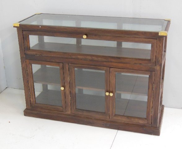 Wood credenza with glass doors: Brass appointments. Approx. 43" W x 15.5" D x 30.5" H.