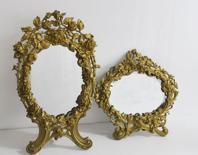 2 bronze "Floral" standing mirrors: Approx. 11" H x 10.5" W & 16.25" H x 9.5" W.