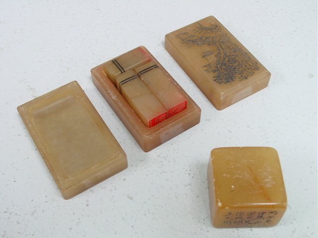 3 part soapstone case with 3 seals & inkstone: Etched "Mountain Landscape" on cover, artist signed on bottom & single soapstone. Seal approx. 1.5" square, box 3" x 1.75" x 1.75".