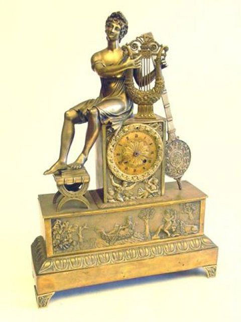 Empire figural bronze mantle clock: Approx. 22" H x 15.5" across.