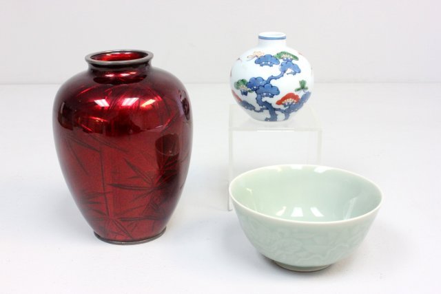 Group lot of 3 Asian smalls: Including: 1- Chinese Celadon rice bowl, approx. 4.5" W x 2". 1- Porcelain bud vase, approx. 3" H. 1- Red champleve vase.