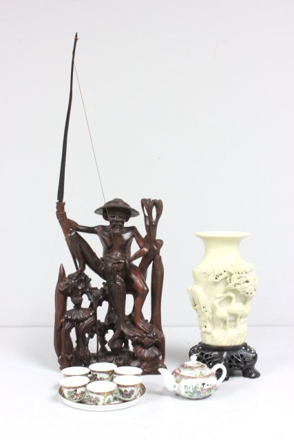 Group lot of Chinese smalls: Including: 1- Wood carving of "Fisherman with Fish", approx. 12.75" x 7.5". 1- Soapstone vase on stand, depicting "Birds & Pon Trees", approx. 10" H in total. 1- Porcelain miniature teaset, 6 tea cups