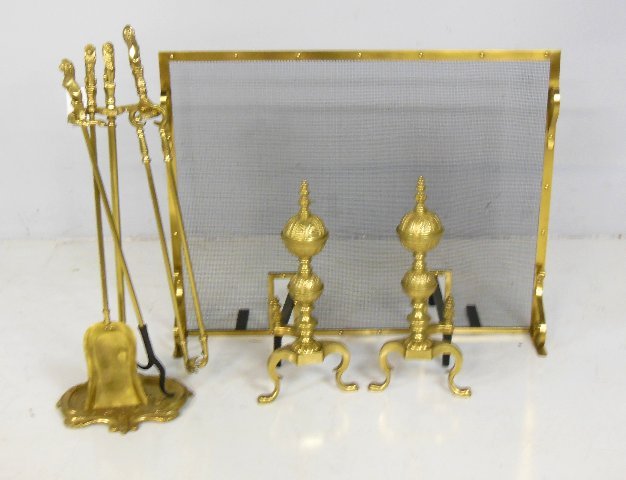 Brass fireplace set: Consisting of: Fireplace screen, pair of andirons, fireplace tools & stand with "Lions Heads".