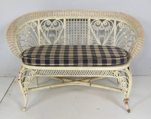 Wicker loveseat with stick & ball: Wicker is as is on right front leg. Approx. 30" H x 40" W.