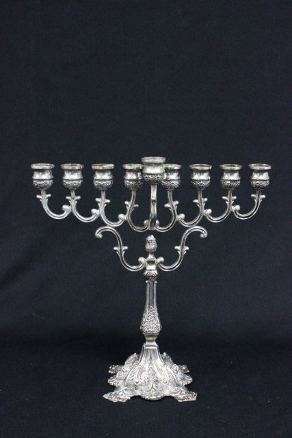 Silverplated rococo style menorah: Approx. 14" H x 12.5" W.