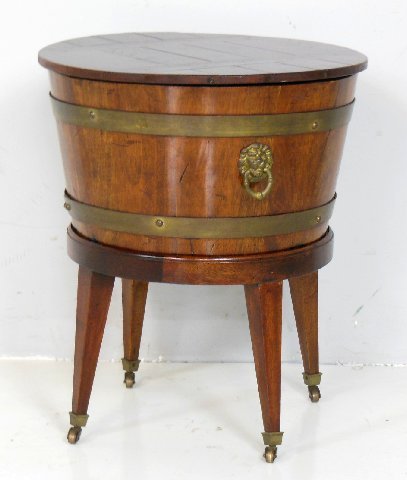 Regency brass bound covered cellarette: On stand, with "Lion Head" handles. approx. 23.5" H x 20" Diam.