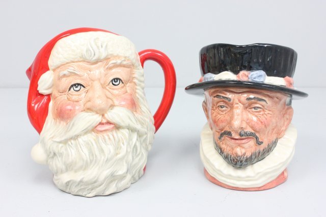 2 Royal Doulton mugs: Including: "Beefeater", D6206. "Santa Claus", D6704.