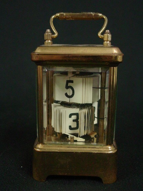 The Plato calendar carriage clock: Approx. 5.25" H. From a Plainfield, NJ estate.