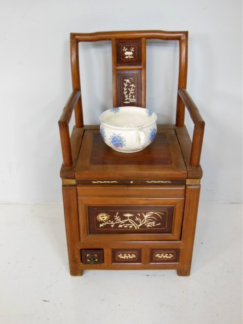 Chinese rosewood & carved bone inlay commode: With lift up seat & blue floral pottery chamber pot, 2 small moldings missing. Approx. 19" arm to arm, 34" H at back, 19" H at seat.