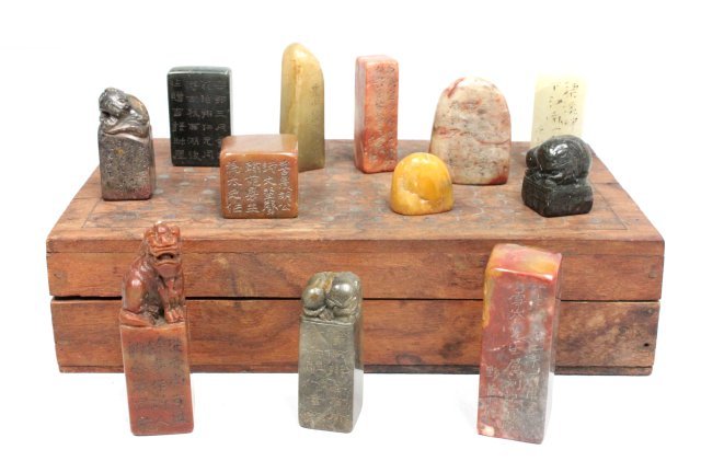 12 soapstone seals: Figural & carved, in old box. some as is