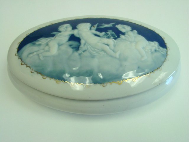 Oval pate-sur-pate covered limoges box: With "Angels". Approx. 8.5" X 5" X 2.25".