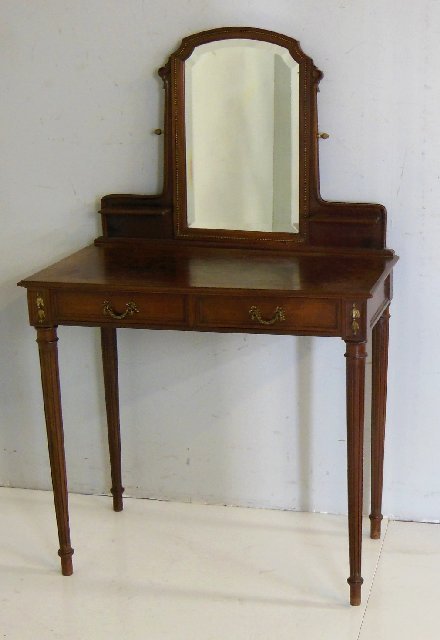 Louis XVI style French inlaid ladies vanity: With bevelled swivel mirror and checkerboard inlaid top. 2 Drawers with bronze swag handles. Approx. 31" W. X 18" Deep.; 30" H to desk top and 51" H. to top of mirror.