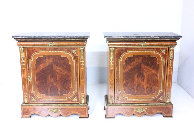 Pair bronze mounted credenzas: With verde marble tops. Mahogany veneer with satinwood inlay. Bronze Grecian moulding. 1 door, 2 interior shelves. Minor veneer losses. Marble top has 1 repaired corner &1 broken corner. Approx. 43" H