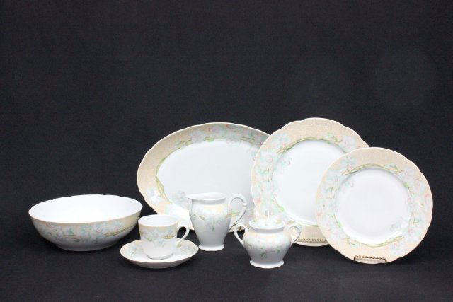 Limoges 'Bernardaud' dinnerware set: 73 pieces in total consisting of: 17- 8.75" luncheon plates, 15- 10.25" dinner plates, 17-saucers, 18 cups, sugar, creamer, 2 serving bowls and 2 oval serving platters.