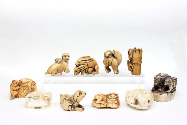 9 carved bone Netsukes & 1 stamp: Netsukes depicting "Animals". Stamp depicting "2 Rabbits". 10 in total. From a Middletown, NJ collection.