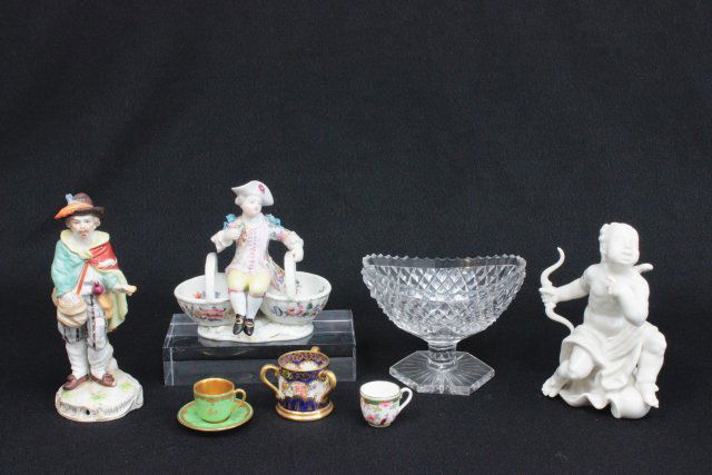Group lot of porcelain: Including: 1- Hutchenreuther cupid, approx. 6" H. 1- Porcelain figure of "Man Feeding Mice". 1- Porcelain figure of "Boy with Flowers on 2 Baskets", approx. 5.25" x 4.75". 1- Staffordshire "Loving Cup
