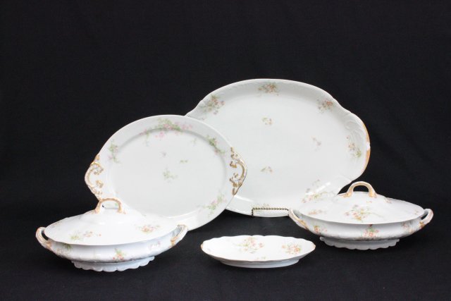 Limoges serving pieces: Including: 3- Platters. 2- Covered casseroles. Chip on edge of large platter.