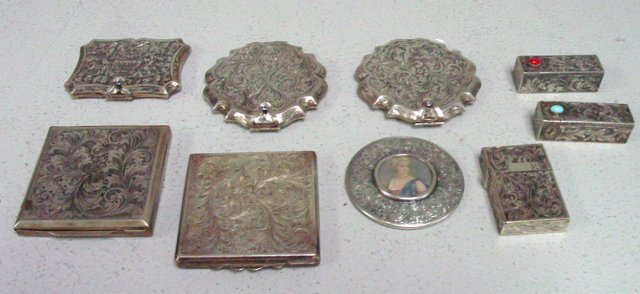 Group lot of assorted silver smalls: Including: 5- Silver compacts. 2- Lipstick. 1- Lighter case. 1- Mirror.