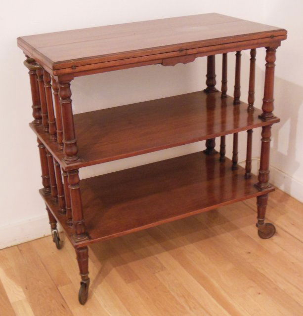 Butler's trolley with folding top: Butler's trolley on wheels with 2 shelves and braided brass handles. Closed approx. 32" Across X 18" Deep X 34" H. Open approx. 36" D. X 32" Across X 34" H. Provenance: Purchased from Tout le Monde, N