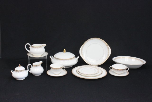 Set of Royal Doulton Dinnerware Gold Lace Pattern: Comprises of: 8 Dinner Plates, 9 Cups, 16 Saucers, 8 Bouillon Bowls, 8 Bread and Butter DIshes, 8 Cake Plates, 1 Gravy Boat with Underplate, Creamer and Sugar, 1 Covered Tureen, 1 Serving Dish, 2 Open