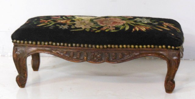 Needlepoint footstool: 2 holes in corner. Approx. 20.5" W x 10.5" D x 7.75" H.