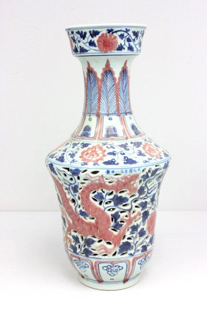 Reticulated Chinese porcelain vase: Depicting "Flowers", blue,white & copper color. Approx. 22.5" H.