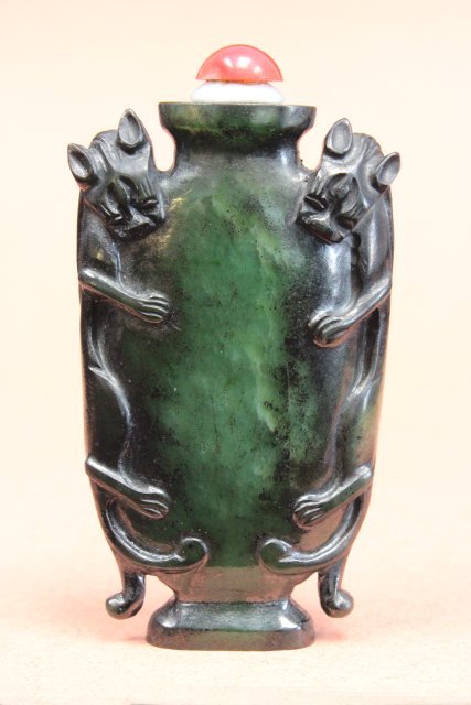 Spinach jade carved snuff bottle: With "Panthers" on each side. Approx 2.5" H.