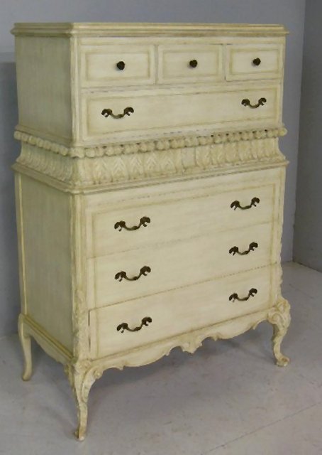 Paint decorated chest of drawers: 4 drawers, 3 small drawers on top, Prince of Whales feather carving. Approx. 55" H x 37.5" W x 19.5" D.