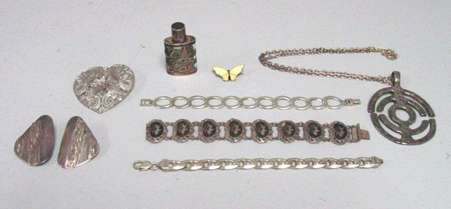 Group lot of silver: Including: Silver perfume bottle, filigree heart shaped pin, 2 link bracelets, modern necklace-Erik Denning, pair silver earrings & sterling "Siam" bracelet, enamel butterfly pin by David Andersen.