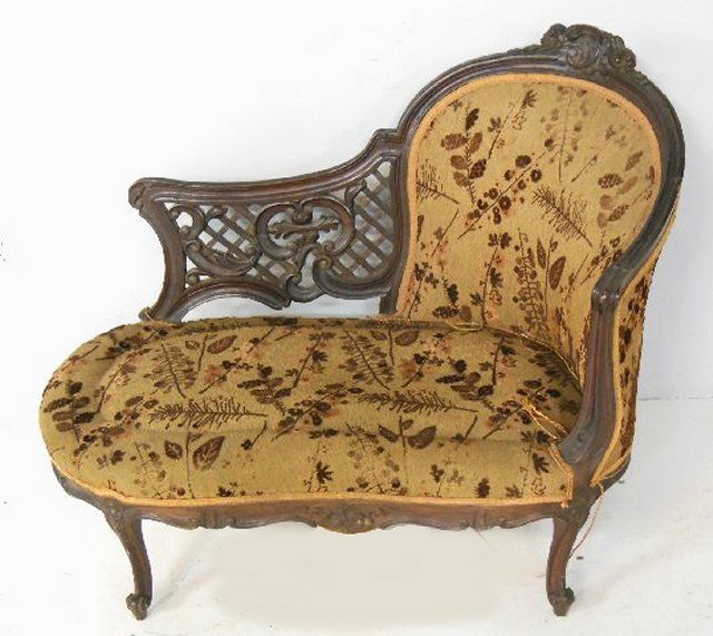 Late 19th c. French carved walnut chaise lounge: Missing cushion. Approx. 35.5" H x 36" L.