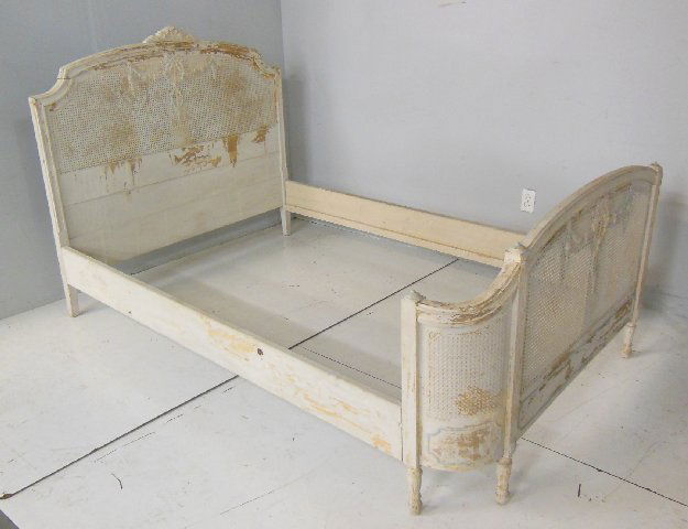 French paint decorated bed: With cane on headboard & footboard, as is. Approx. 49" H x 56" W. From the Chateau des Thon, which originally was built and located outside of Dijon, France in the early 18th century.
