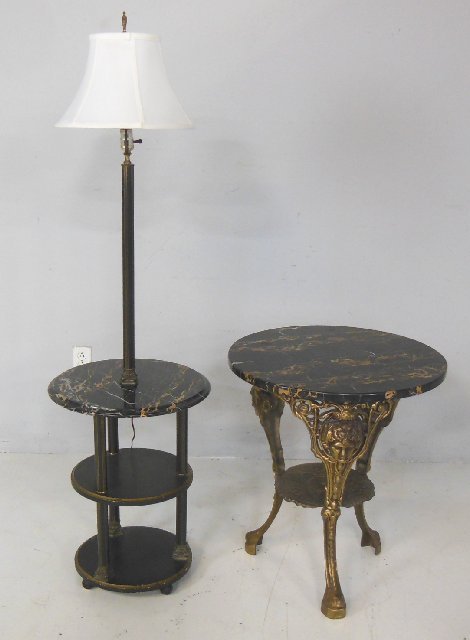 Group lot of 2 tables: 1- Marble top & brass figural based side table, approx. 26 1/2" H x 23 2/3" Diam. 1- Marble top pole lamp table, approx. 17 3/4" Diam x 48" H. From the collection of a New Brunswick Victorian Mansion.