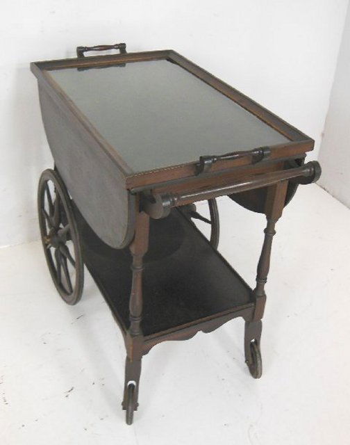 Mahogany teacart: With lift up tray top. From the estate of Doris Schwerin, Author.