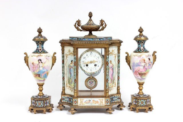 19th c. French enameled crystal & bronze clock set: Includes porcelain pendulum Handpainted, depicting "Cupid with goddesses." Artist signed. Approx. 18.5" H. x 11" across x 5.5" D. Marked France. "Fried Lavender Co." stamped on works.