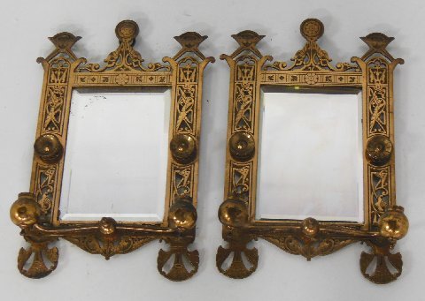 Pair bronze mirrored candle sconces: In the manner of Christopher Dresser. Approx. 17" H x 10" W.