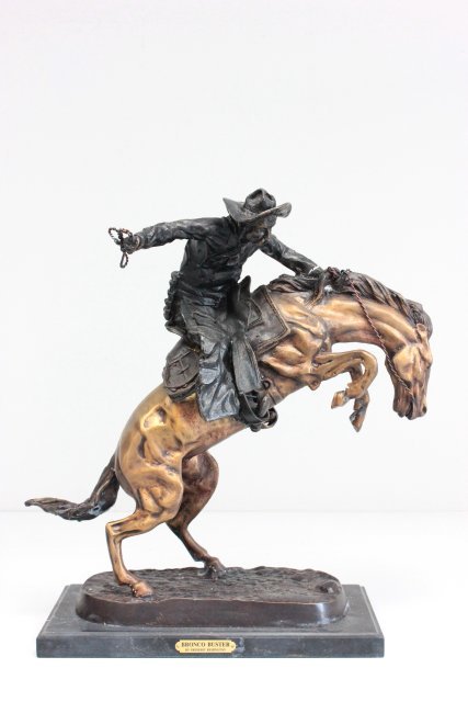 Bronze reproduction "Bronco Buster": By Frederic Remington. Approx. 21.5 H.