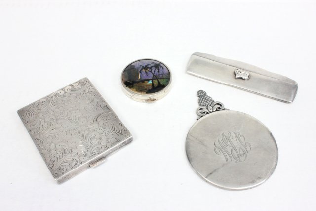 4 Silver makeup pieces: Including: Sterling sliver mirror, sterling comb cover, silver compact and plated round makeup with enameled top depicting palm trees.