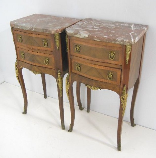Pair of Bronze mounted commodes: Pair of Bronze mounted banded walnut and satinwood, rouge marble top 2-drawer commodes. Serpentine fronts. ca. 1920's-30's Approx. 29.5" X 11.5" X 16".
