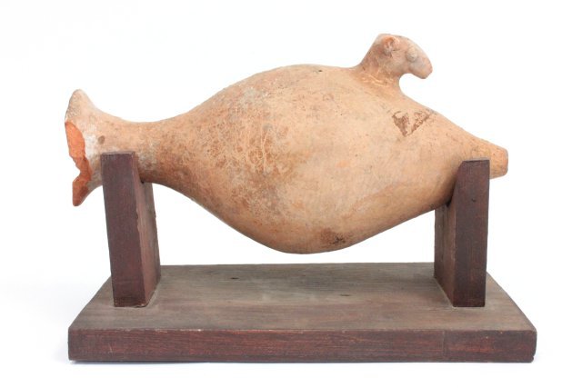 Sumerian clay urn with "Horse Head": Chipped rim, base missing. Approx. 9.5" H. Collection of Middle Eastern antiquities from a Long Island, NY collection. All property from the Field Estate in East Hampton, NY. All antiquities have not 
