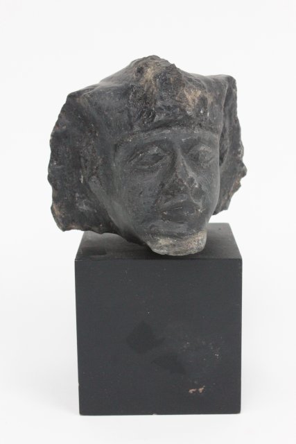 Egyptian stone bust 300 B.C.: On wood base. Approx. 4" x 4" x 4". Collection of Middle Eastern antiquities from a Long Island, NY collection. All property from the Field Estate in East Hampton, NY. All antiquities have not been ap