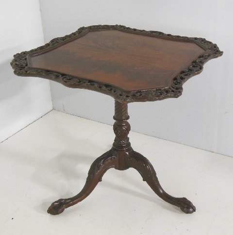George III style mahogany piecrust tilt top table: 2" pierced carved edge. Approx. 29" x29".