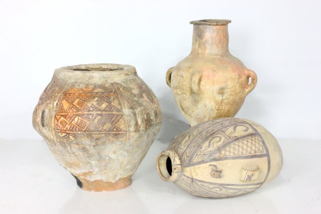 Group lot of 3 Middle Eastern clay vessels: Including: 1- Chancay Peruvian urn 1200 A.D., as is, approx. 20" x 14" W. 1- Caananite clay vessel 2000-1500 B.C., worn paint of "Animals", 4 loops, approx. 23" H x 12" D. 1- Caananite clay vessel "Ge