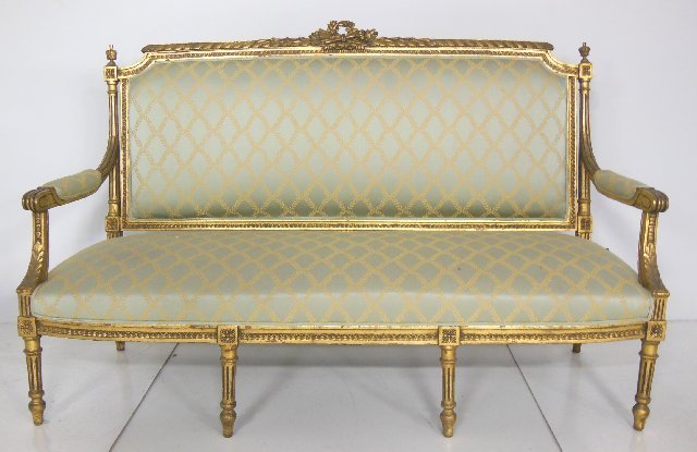 Giltwood reproduction loveseat: Louis XVI style. Approx. 64" across x 40" H.