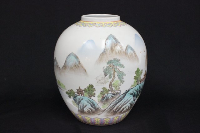 Chinese porcelain vase: Depicting "Mountain / Lake Scene'". Approx. 9.5" H.